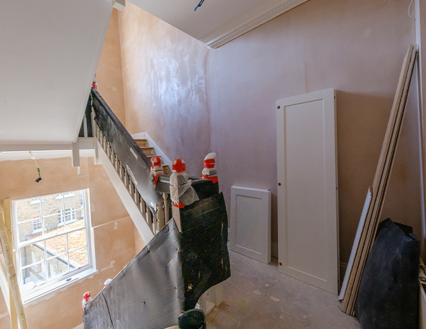spacious bedroom with wooden furniture and a chandelier in a neutral color scheme featuring seven pieces of furniture
