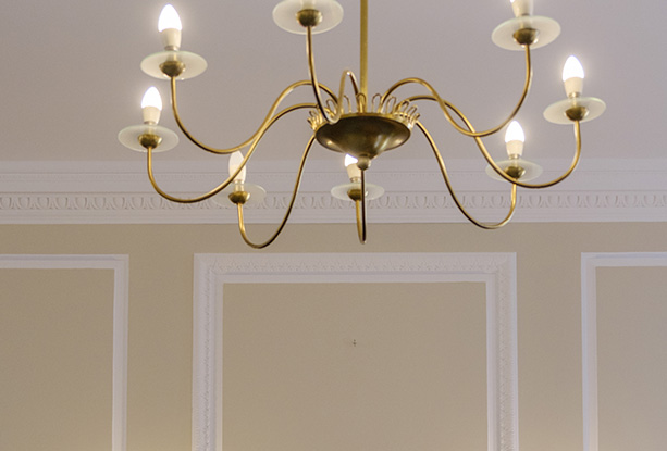 newly painted window with painter's tape covering the glass in four sections during renovation process