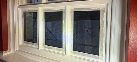 close up of stacked stone wall with various textures and colors showing details of seven different stones